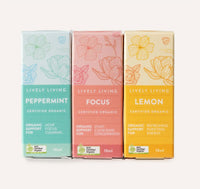 Three boxes of Lively Living tea on a white background