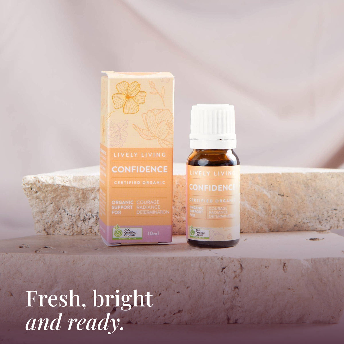 Confidence 10ml oil and box on a travertine stone stand: fresh, bright and ready