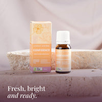 Confidence 10ml oil and box on a travertine stone stand: fresh, bright and ready