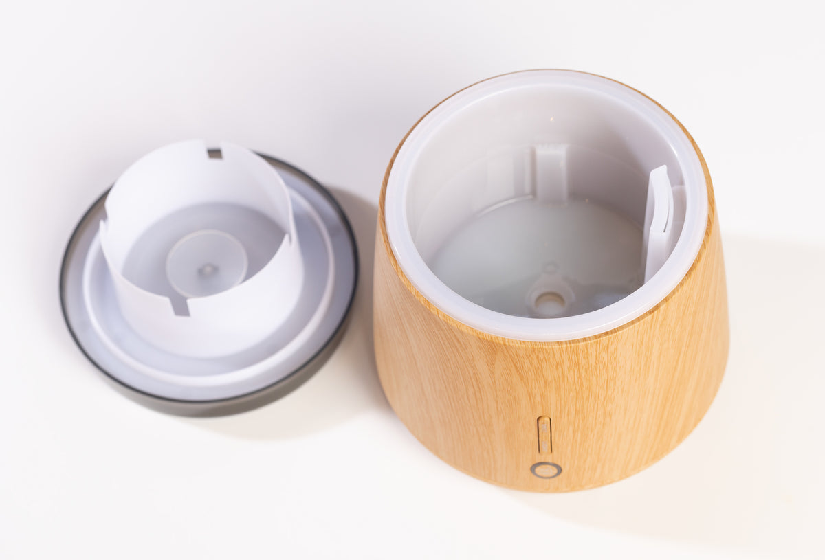 Wooden diffuser with white interior on a light background