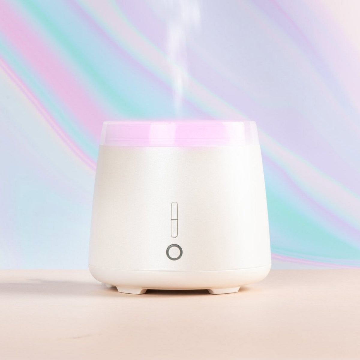 Five aroma diffusers in various colors including white, black, rose gold, and wood finish, displayed side by side.