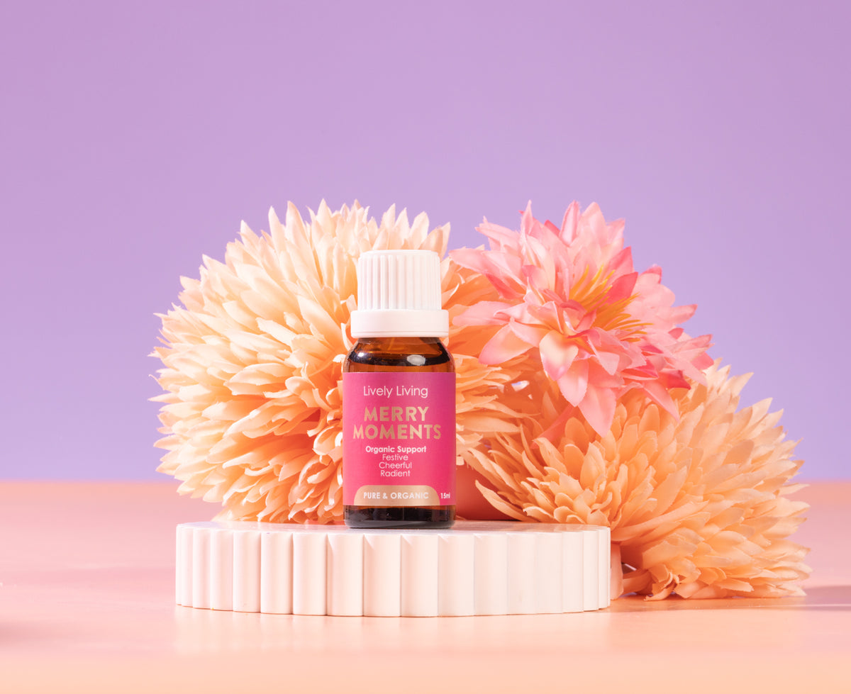 Glycyrrhiza bottle with pink label on a white stand against a purple background with decorative flowers.