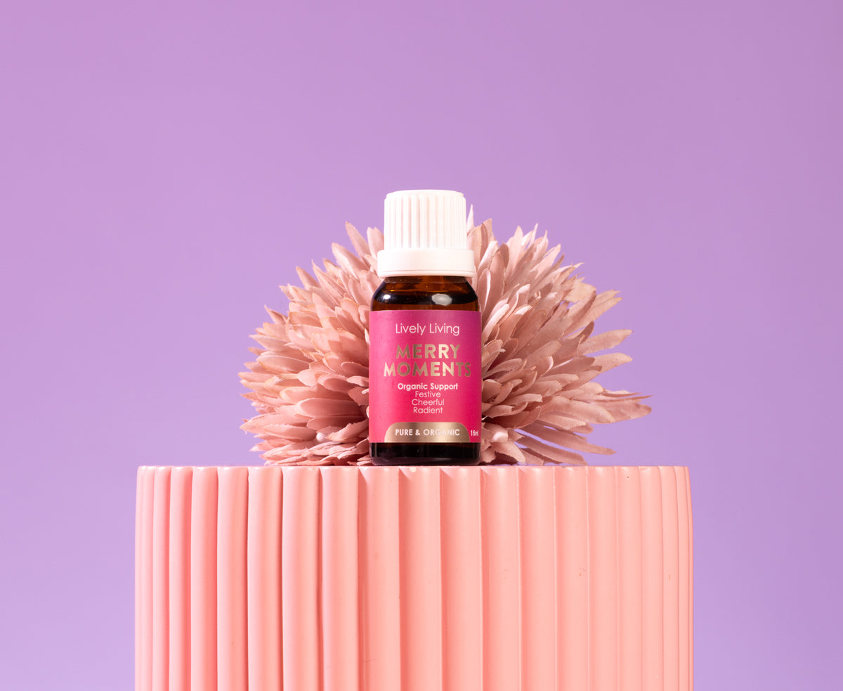 Glycyrrhiza essential oil bottle on a pink textured surface with a purple background