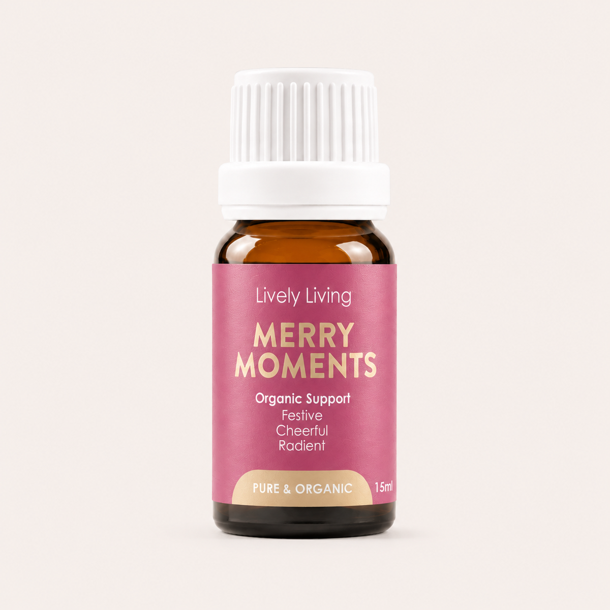 Bottle of Lively Living Merry Moments essential oil on a light pink background