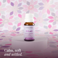 Relax 15ml pure essential oil on a white stand with pink floral print: calm, soft and settled