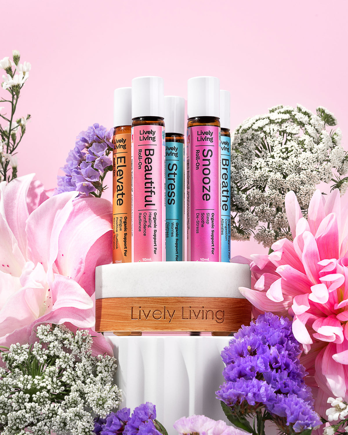 Roll-ons in a timber stand surrounded by pink lilies and purple and white flowers