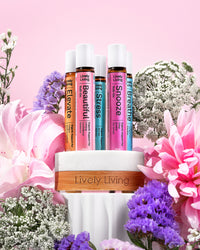 Roll-ons in a timber stand surrounded by pink lilies and purple and white flowers