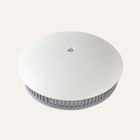 Replacement Aroma-Snooze lid in white with a grey vent ring on a white background