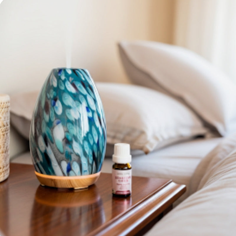 Decorative diffuser and bottle on a wooden surface with a blurred background
