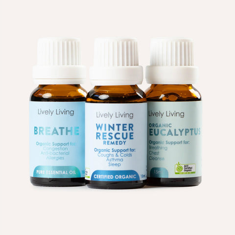 Three bottles of Lively Living essential oils on a white background