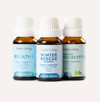 Three bottles of Lively Living essential oils on a white background