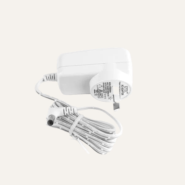 White replacement power adapter with coiled cord