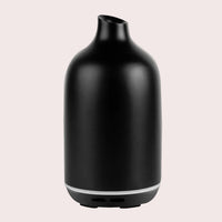 Matte black Aroma-Dune resin diffuser, front view on a white background